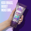 An image of a hand holding Aussie SOS 3 Minute Miracle Blonde Hair Conditioner and a sentence: 'Kick brass, boost moisture'