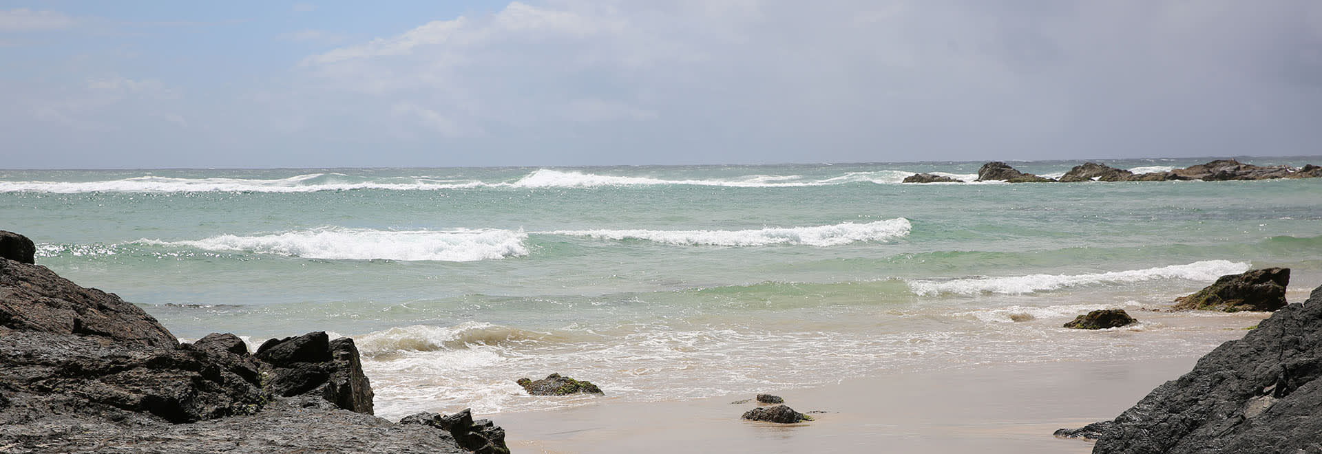 Beach with waves going out to sea