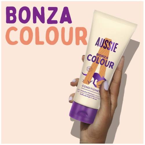 A picture of bonza color conditioner tube in hand with claim: bonza colour