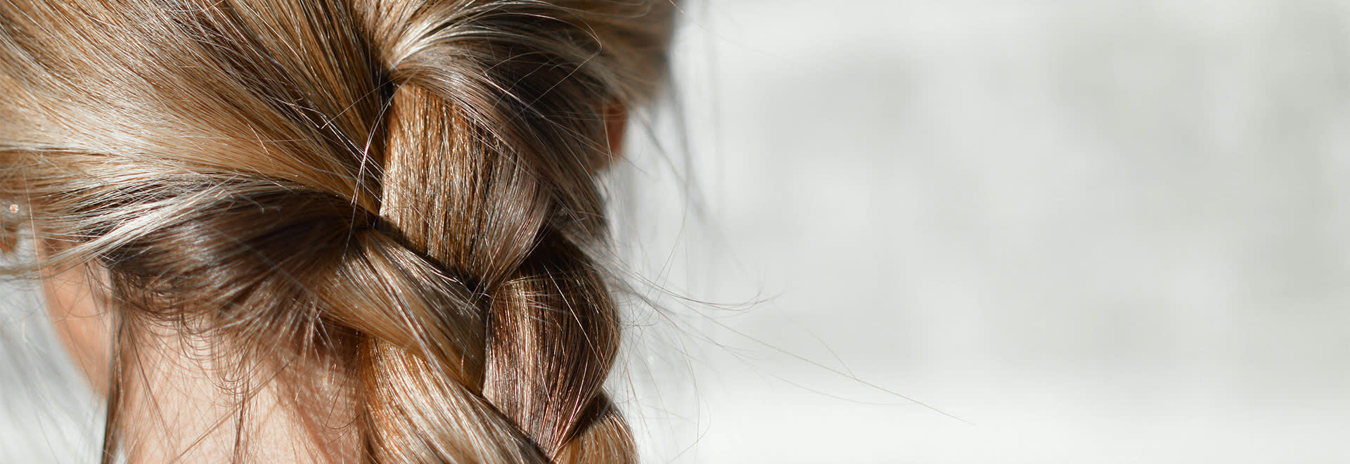 A close-up photo of braid in blonde hair