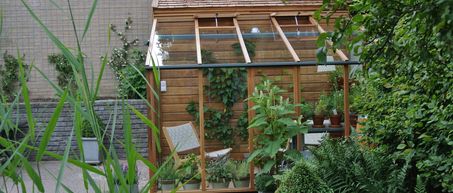 houten tuinkas aan huis maken