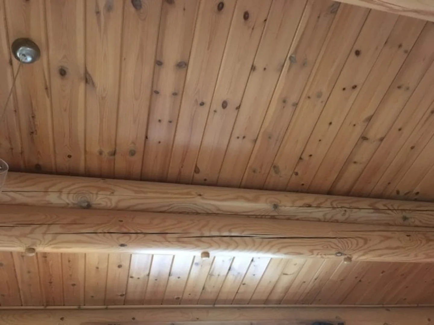 Timber cracks in traditional log cabin