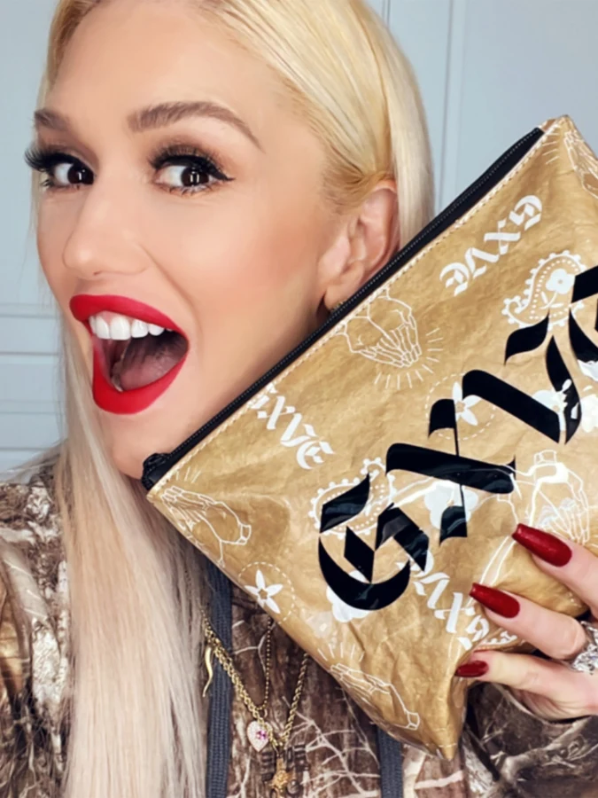 Gwen holding GXVE makeup bag
