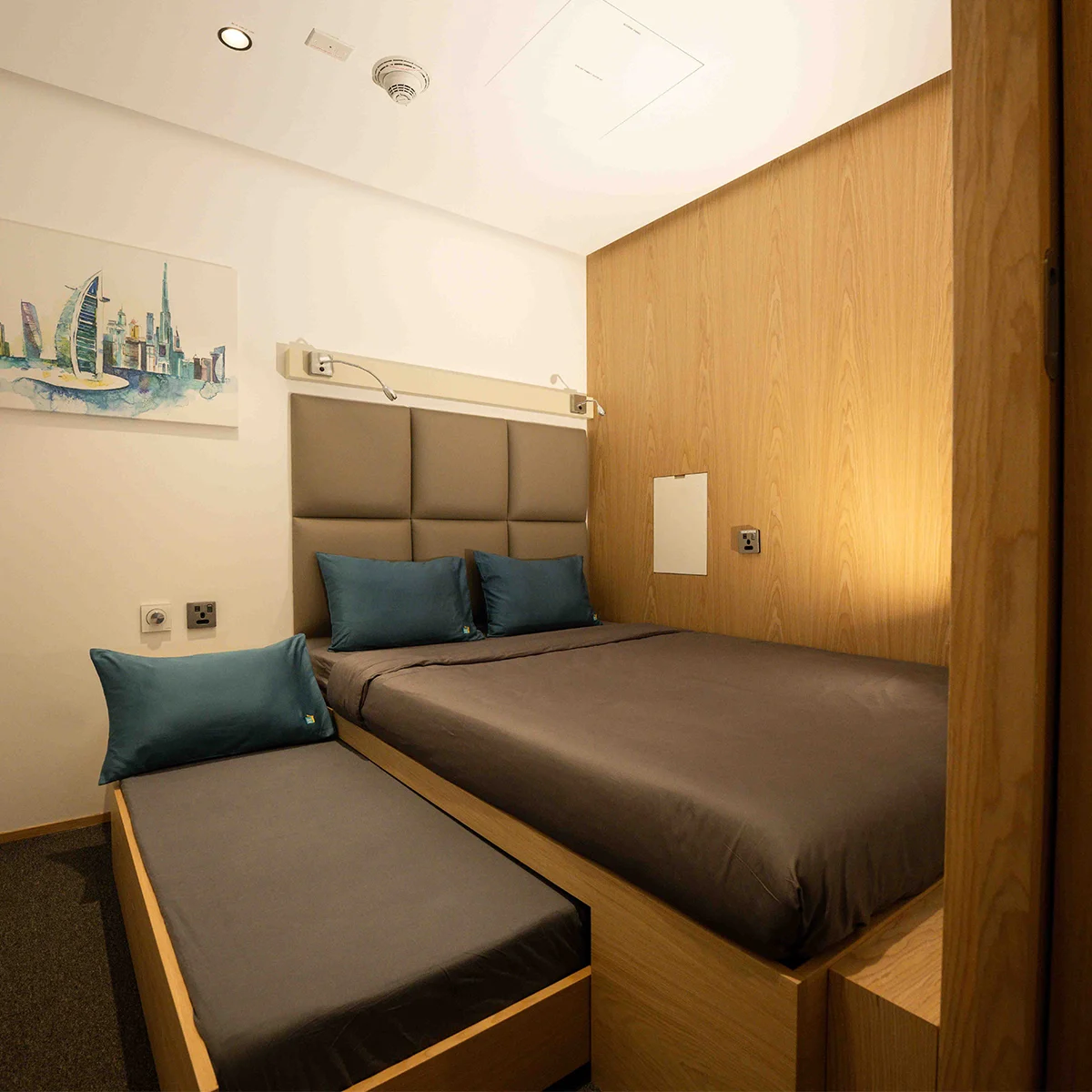 Family cabin at Terminal 3B showing bunk beds, seating space, and integrated lighting.