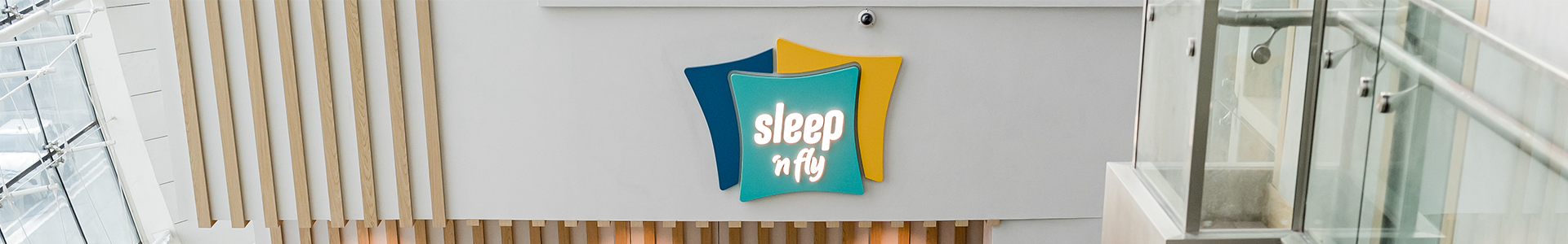 sleep 'n fly logo on wall