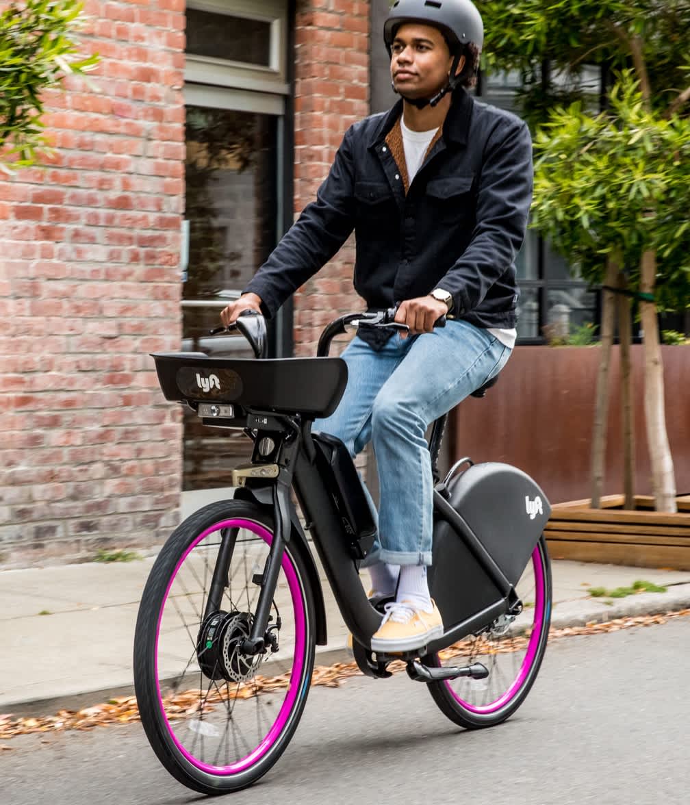 all types of ride photography of Lyft riding bike in the city