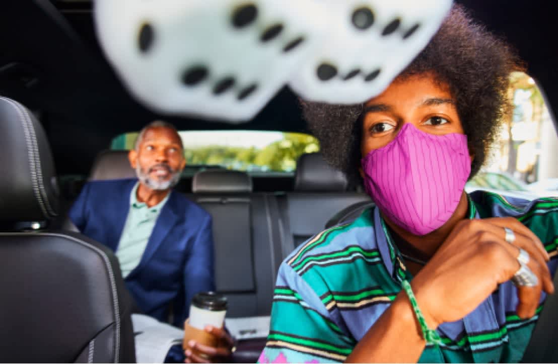 Driver masked-up and rider in Lyft ride