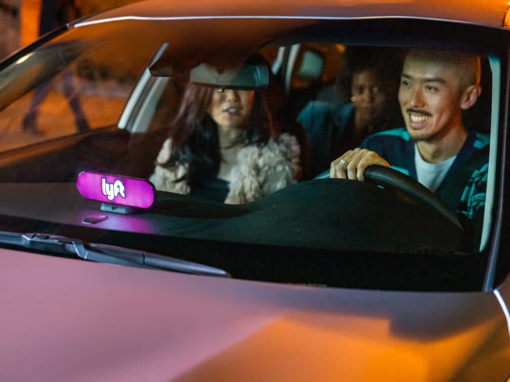 image of Lyft driver and passenger smiling