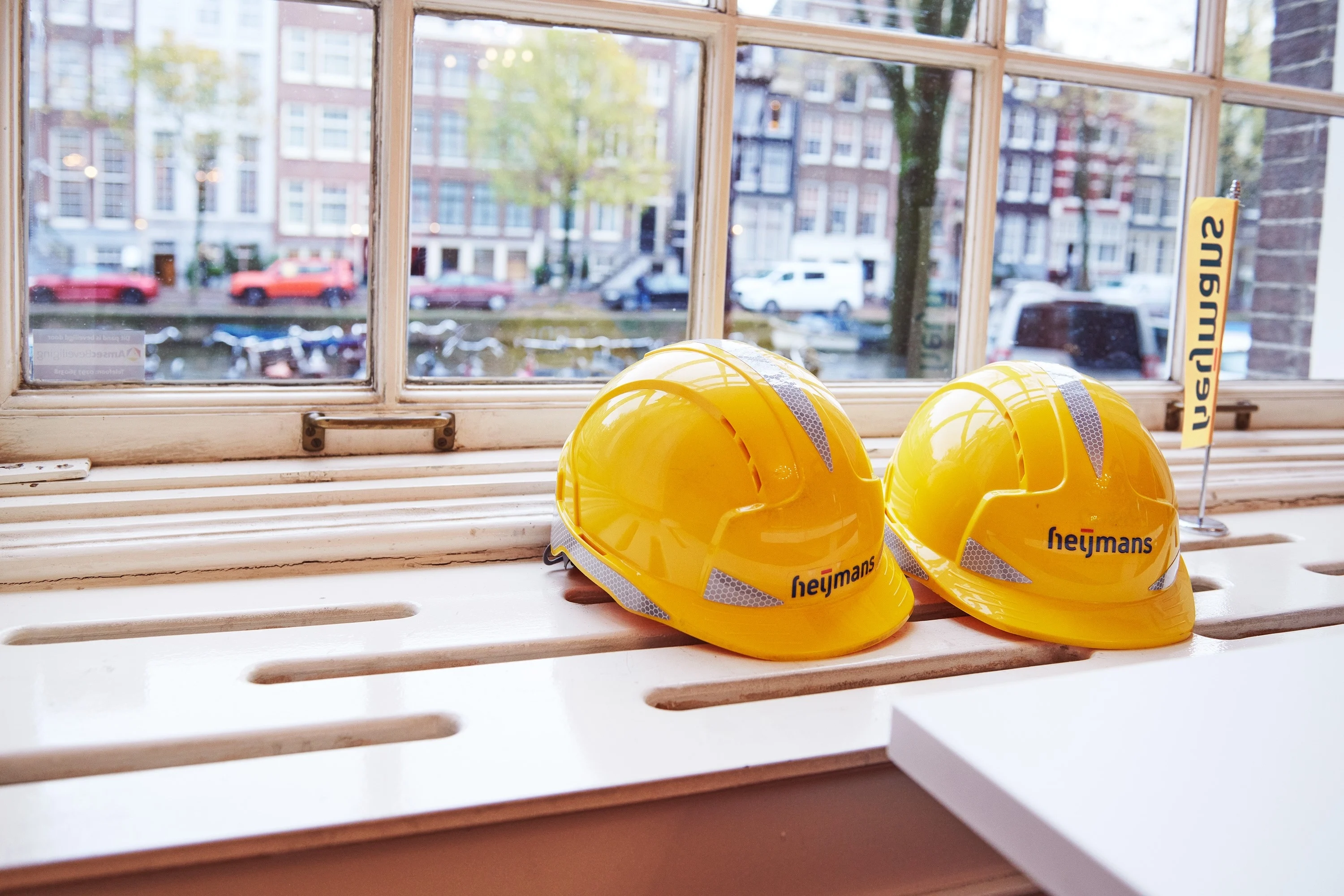 A site worker looks at the Heijmans app on his phone