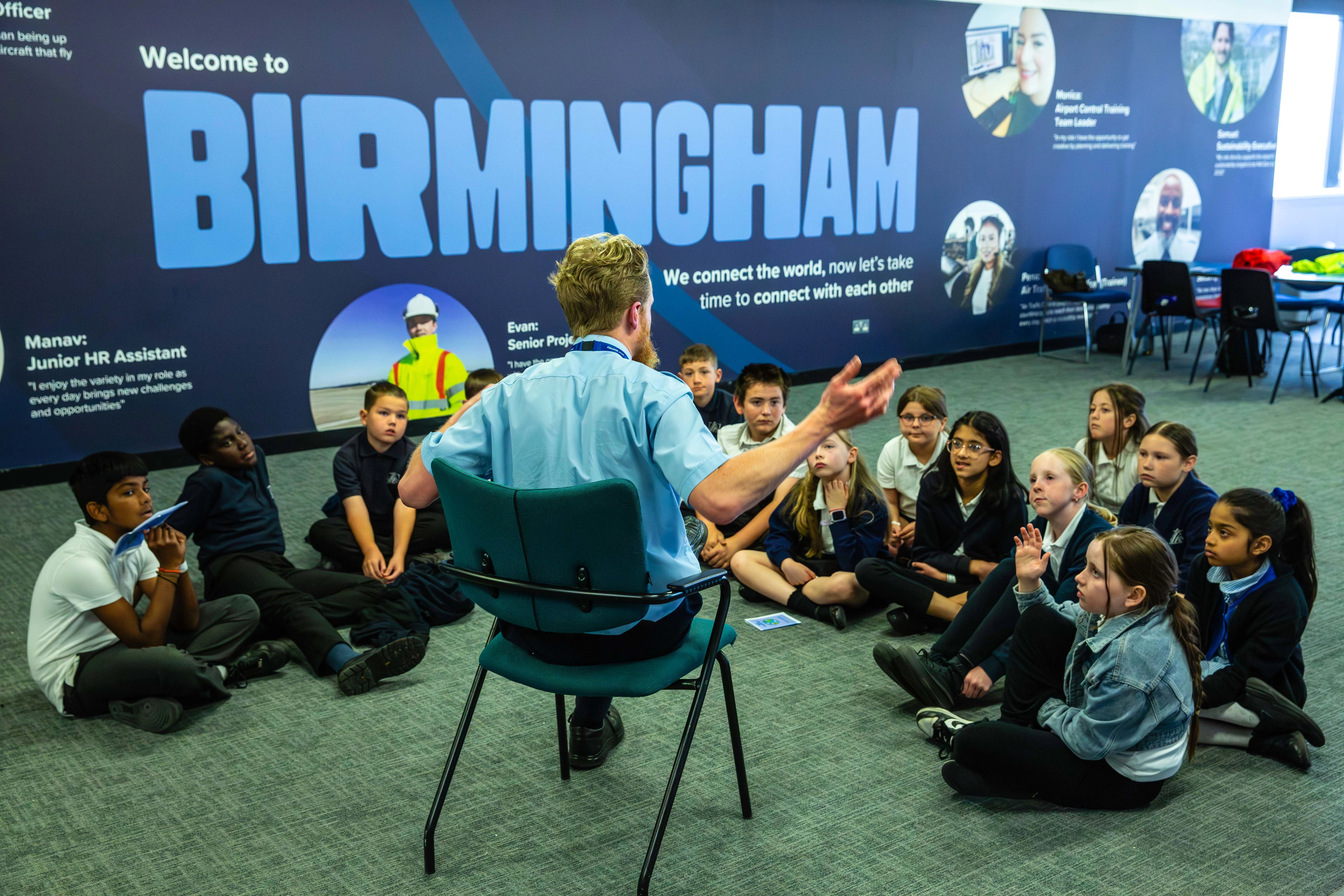 Birmingham Airport staff member presenting to children on educational visit