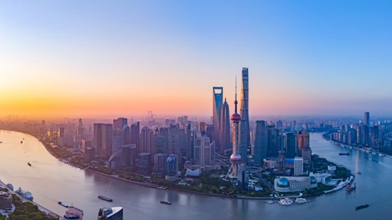 A aerial view of Shanghai skyline with beautiful fire clouds at sunrise.