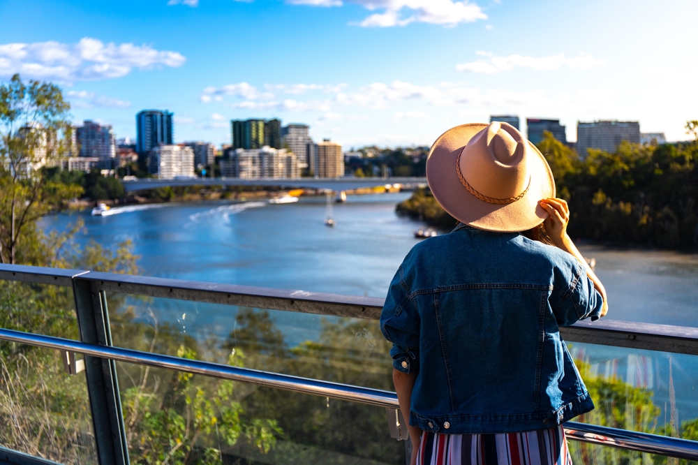 Brisbane beautiful woman in a hat enjoying panorama of brisbane Landscape