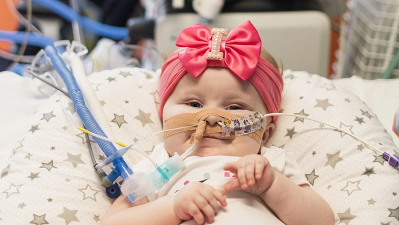 A picture of a child being looked after at Birmingham Children's Hospital