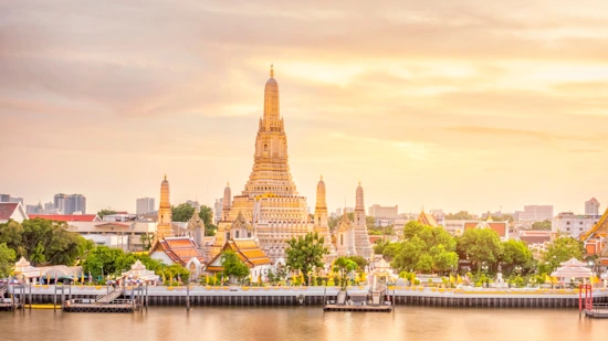 A warm beautiful view of Wat Arun Temple at twilight in Bangkok, Thailand