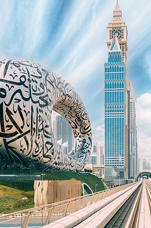 Metro railway among among glass skyscrapers in Dubai.