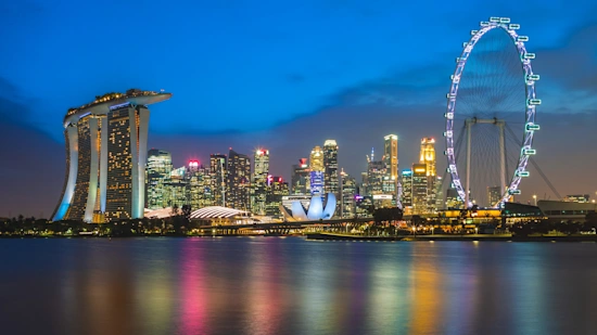 A picture of the skyline of Singapore at Marina Bay and Gardens - spectacular colourful views of the city surrounded by the bay.