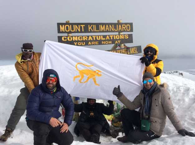 Trekkers celebrating after a successful summit to the highest point of Africa! 