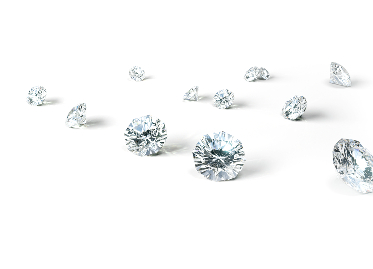 A scattering of 12 beautiful, radiant Skydiamonds on a white background - pure, ethical diamonds