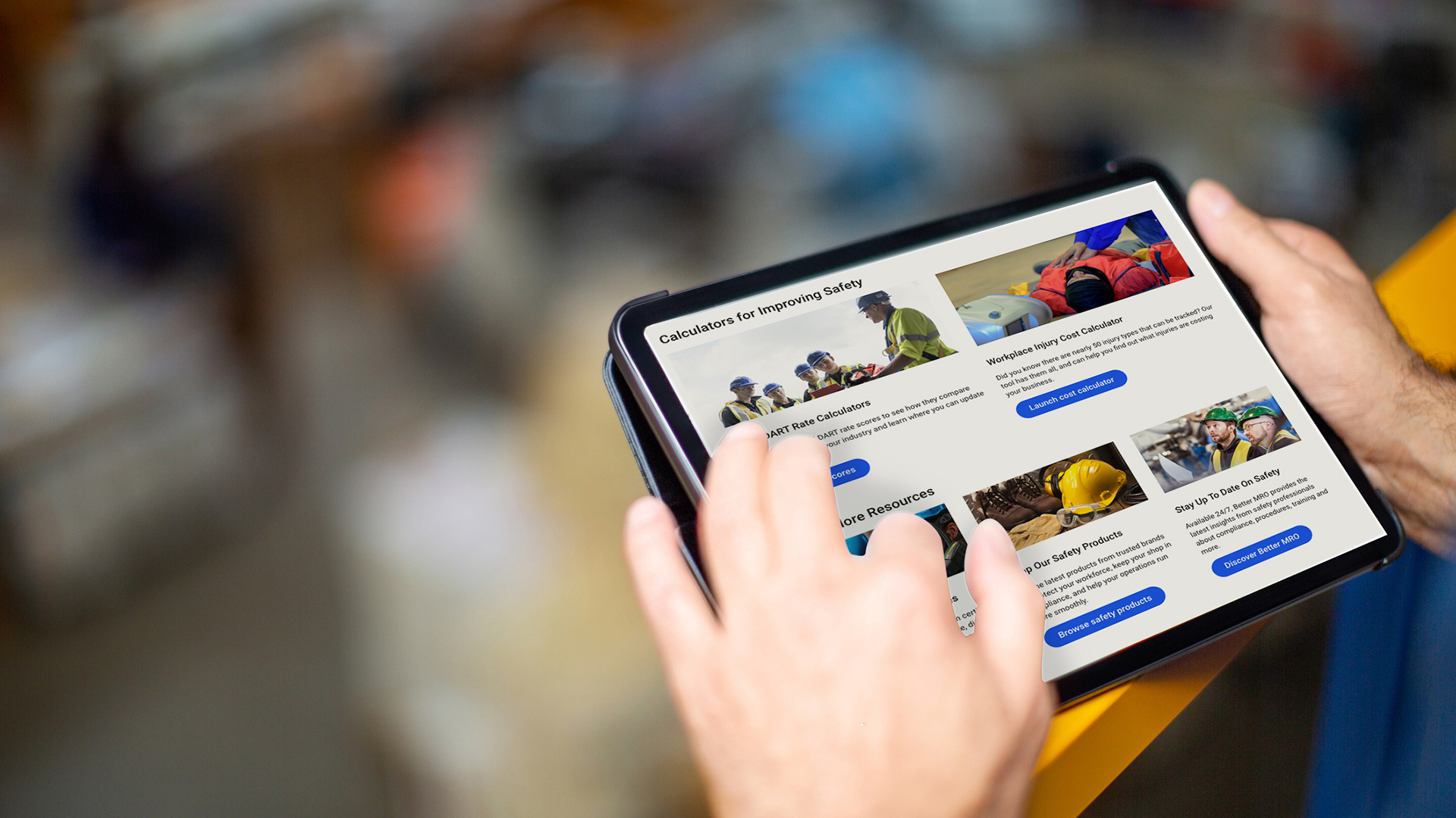 Person holding tablet displaying workplace safety resources webpage