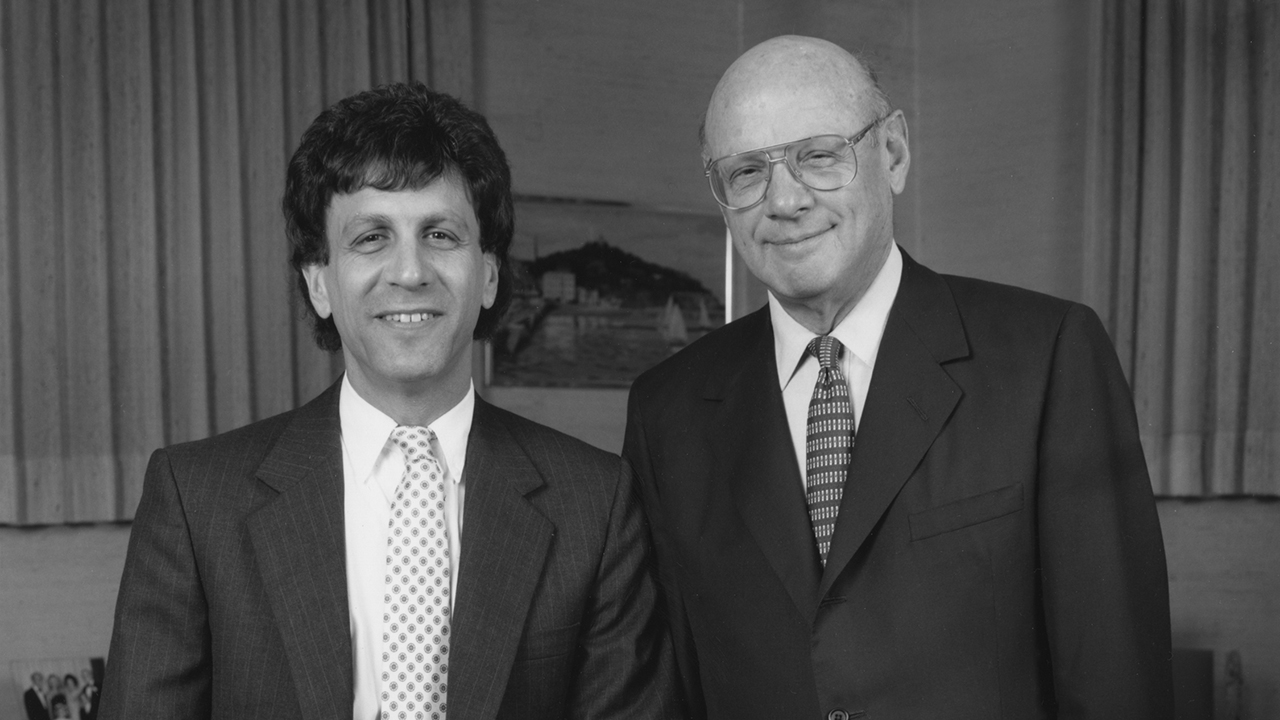 Mitchell and Sid Jacobson posing for a photo