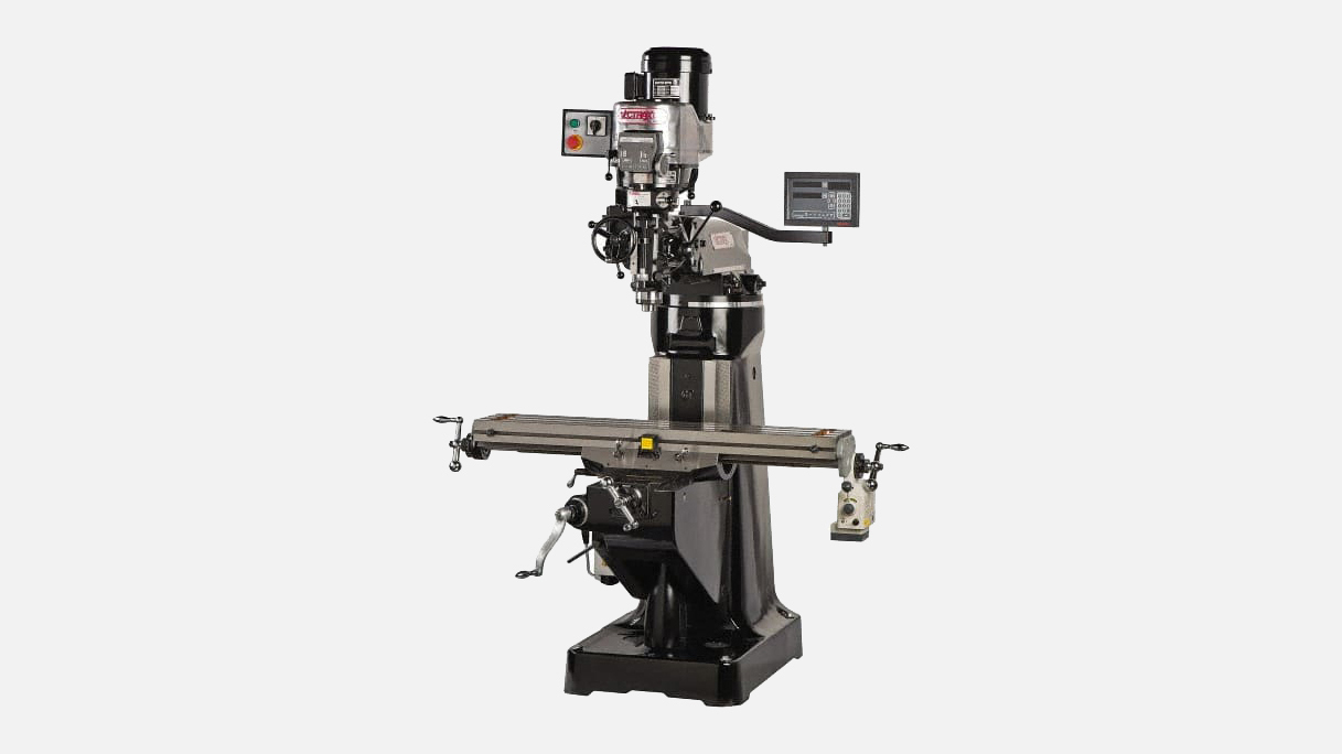 Industrial vertical milling machine with digital display, gray and black metal construction, control panel, and work table