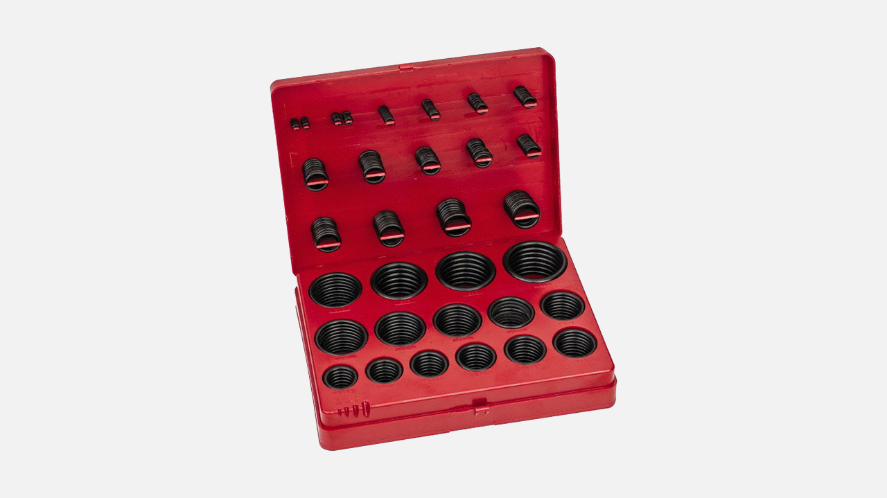 Red plastic case containing black rubber O-ring assortment in various sizes organized in compartments