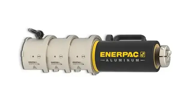 Enerpac aluminum hydraulic cylinder with beige body sections and black end cap with yellow branding on white background