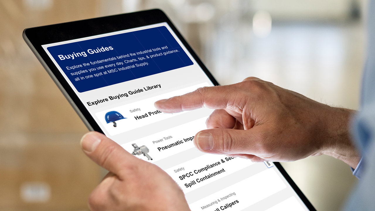 Close up of person holding and pointing to an iPad screen showing the MSC Buying Guide webpage