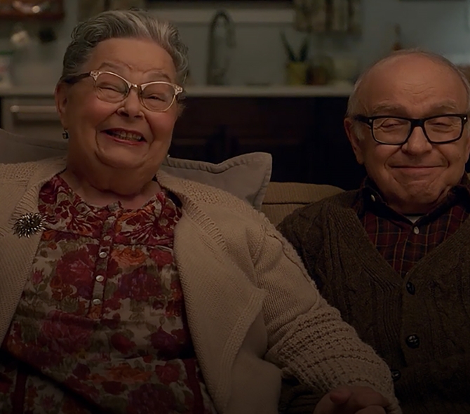 Senior adults sitting and smiling
