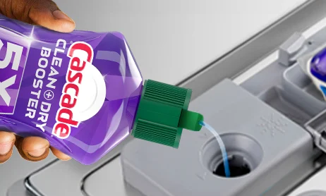 Pouring liquid Cascade drying agent before running dishwasher