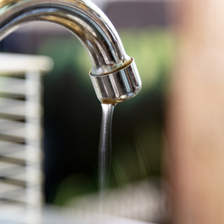 image of a dripping tap at city plumbing