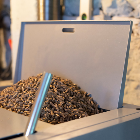 Image of a boiler container full of biomass fuel at city plumbing