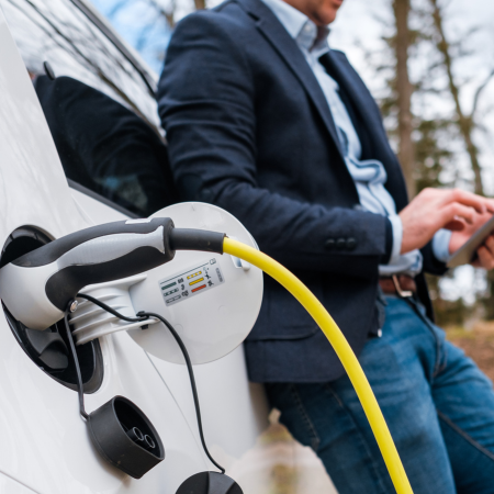 Image of EV charger plugged into a car - EV Chargers FAQs - Your Common Questions Answered