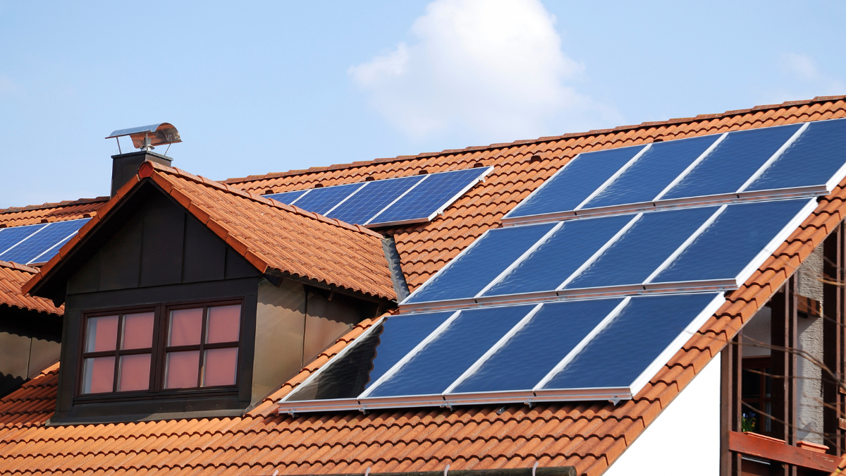 Customers property with solar panels on the roof at city plumbing