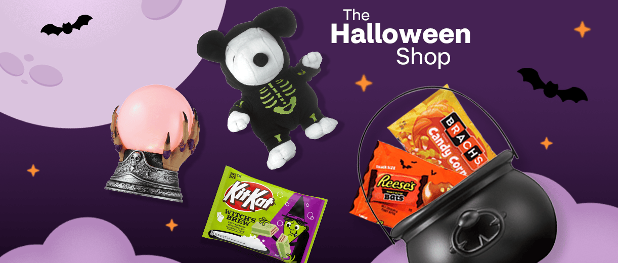 The Halloween Shop, a witch's globe, Snoopy in a skeleton suit, bags of KitKat, Brach's candy corn and Reese's Bats candy