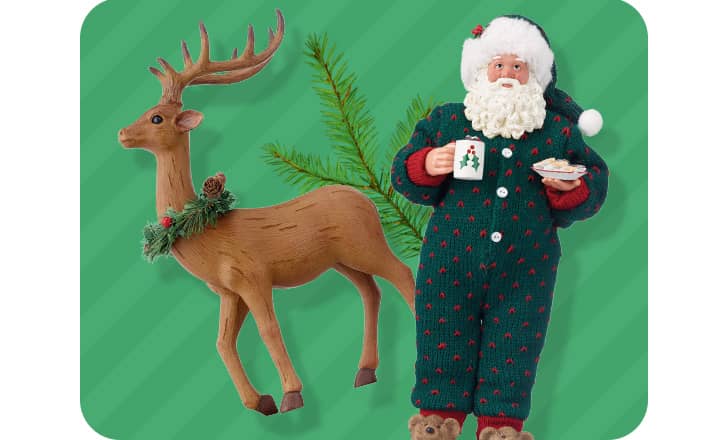 A reindeer figure wearing a wreath and a Santa figure in pajamas.