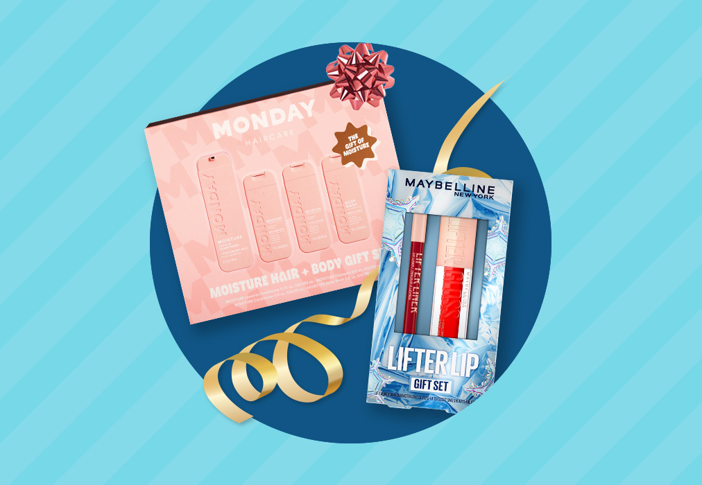 A boxed Monday Moisture Hair and Body gift set and a box of Maybelline Lifter Lip gift set.