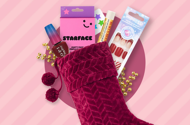 A Christmas stocking with OPI nail polish, Starface Party Pack, Burt's Bees lip balm and imPress press-on nails.