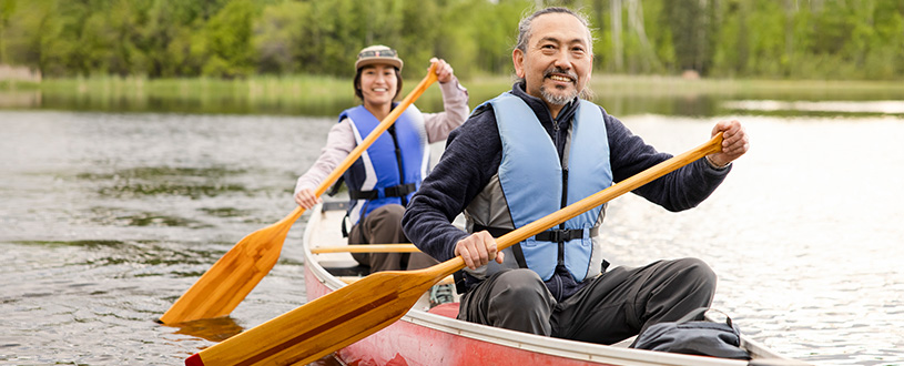 Two people canoeing on a lake