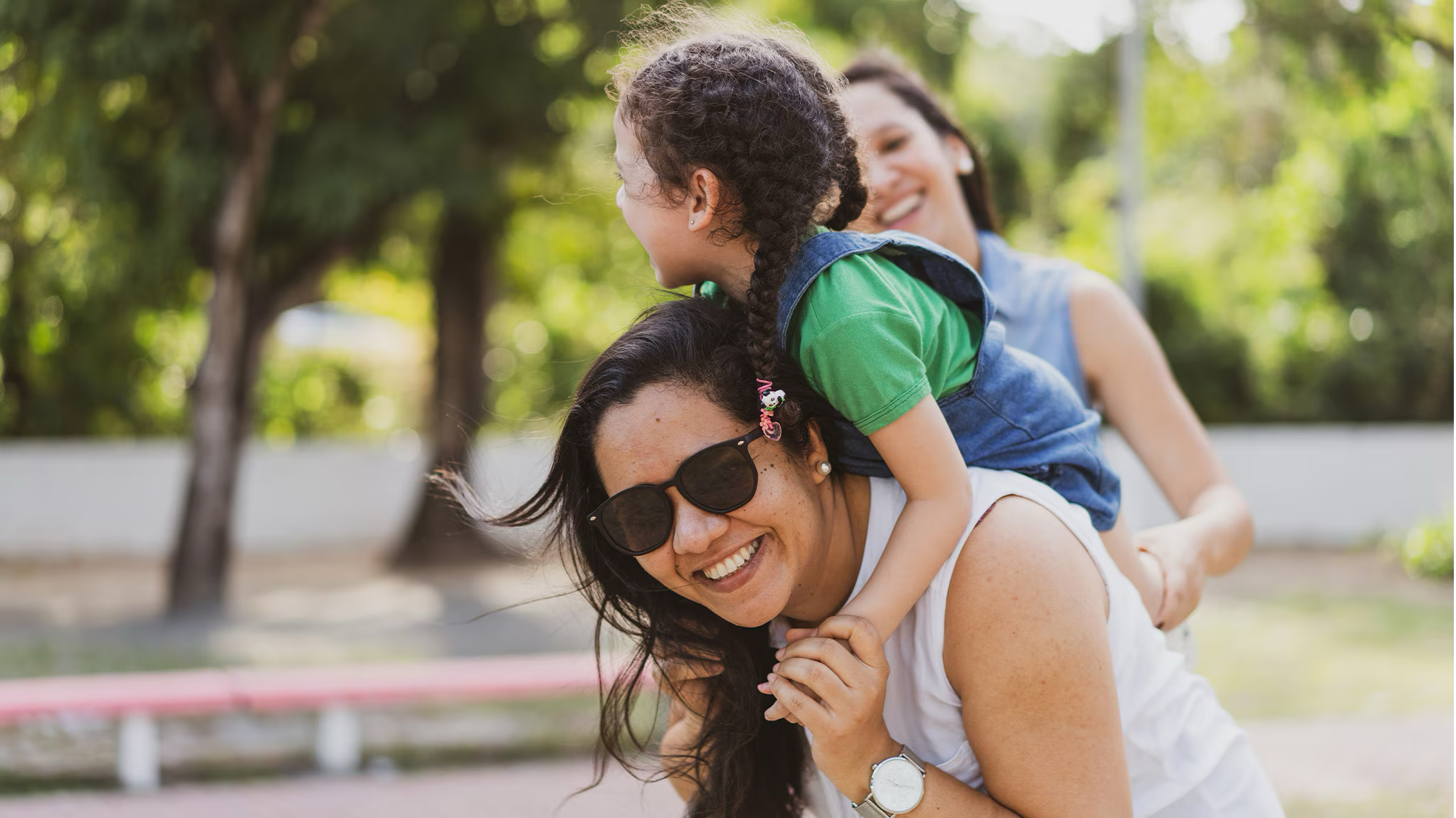 Woman playing with her children outside