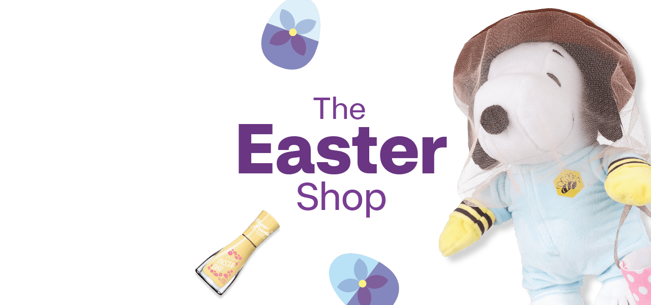 The Easter Shop, a blue Easter egg basket with a plush Snoopy doll, yellow nail polish, Cadbury mini eggs, Lindt golden bunny and Easter eggs against a blue background