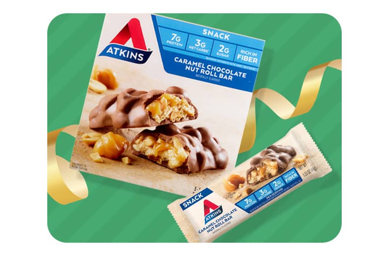 A box of Atkins Caramel Chocolate Nut Roll Bars and a single snack bar.