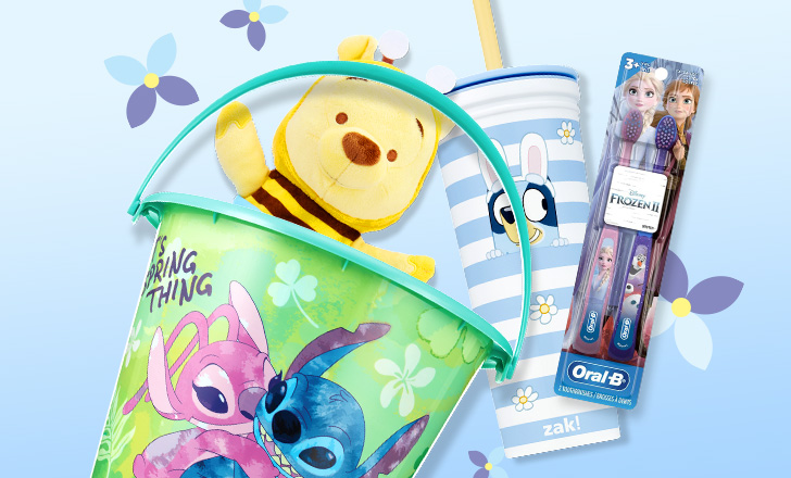 Lilo and Stitch Easter basket with a Winnie the Pooh plush doll, closed Easter Bluey tumbler and Elsa and Anna Frozen II toothbrushes with a blue background and spring flowers