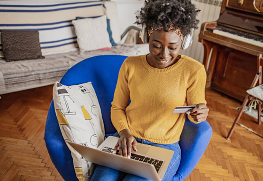 A woman purchasing an e-gift card on her laptop.