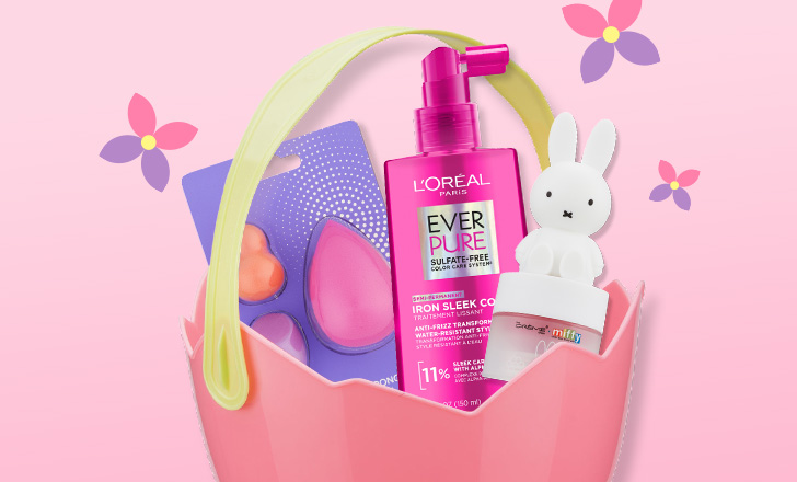 Pink Easter egg basket with  beauty blenders, L'Oréal Ever Pure conditioner and a Miffy bunny against a pink background with purple and pink flowers