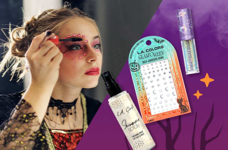 Person putting decorative makeup and self-adhesive gems on their face for Halloween. L.A. Colors Glam'Oween self-adhesive gems, L.A. Girl Shimmer Spray and Fantasy Makers makeup against a purple night sky