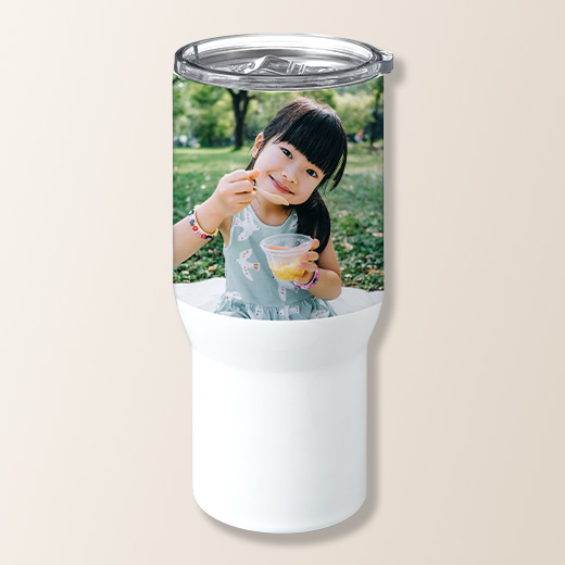 Personalized photo of a child eating a fruit cup on a white tumbler.