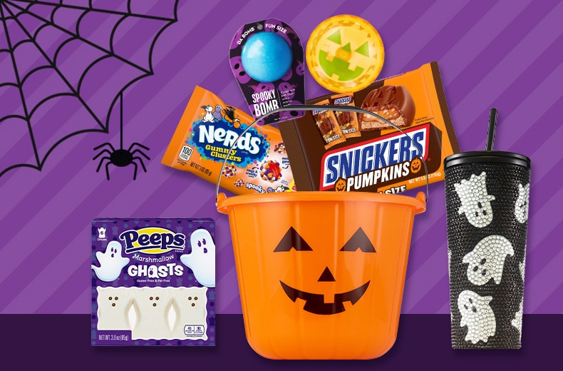 Assorted treats for Halloween baskets, including ghost Peeps, Nerds, Snickers and more