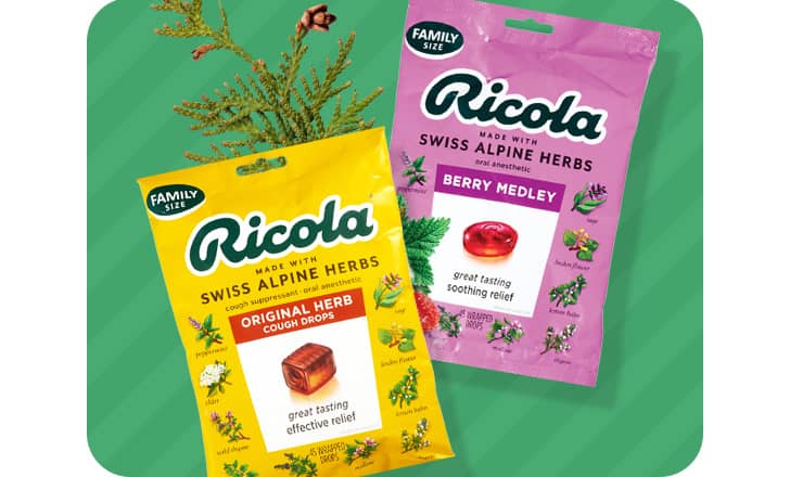 Two bags of Ricola throat lozenges, original and berry medley.