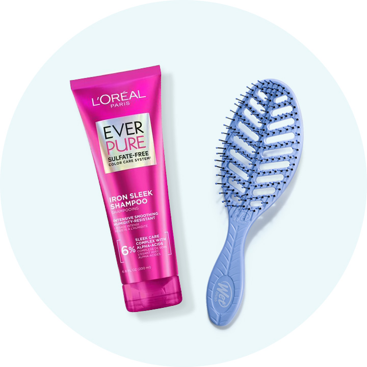 Bottle of L'Oreal Paris Ever Pure shampoo & detangling hair brush